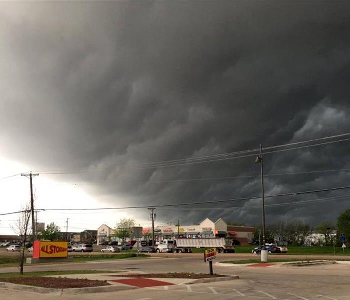 Large storm cloud over a local shopping center.