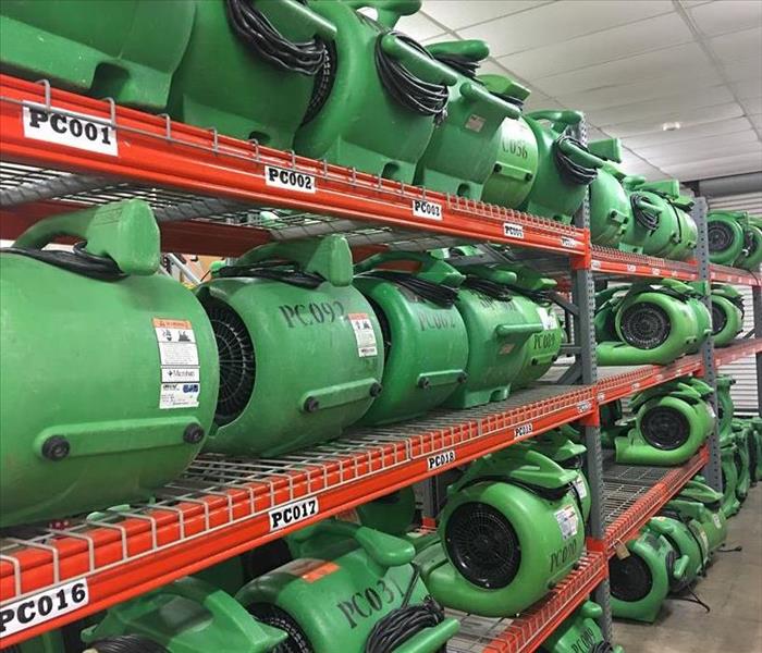 Servpro drying fans in a storage facility.