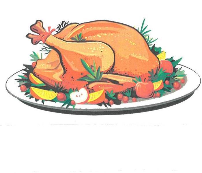 A turkey on a bed of vegetable garnishments on a plate.